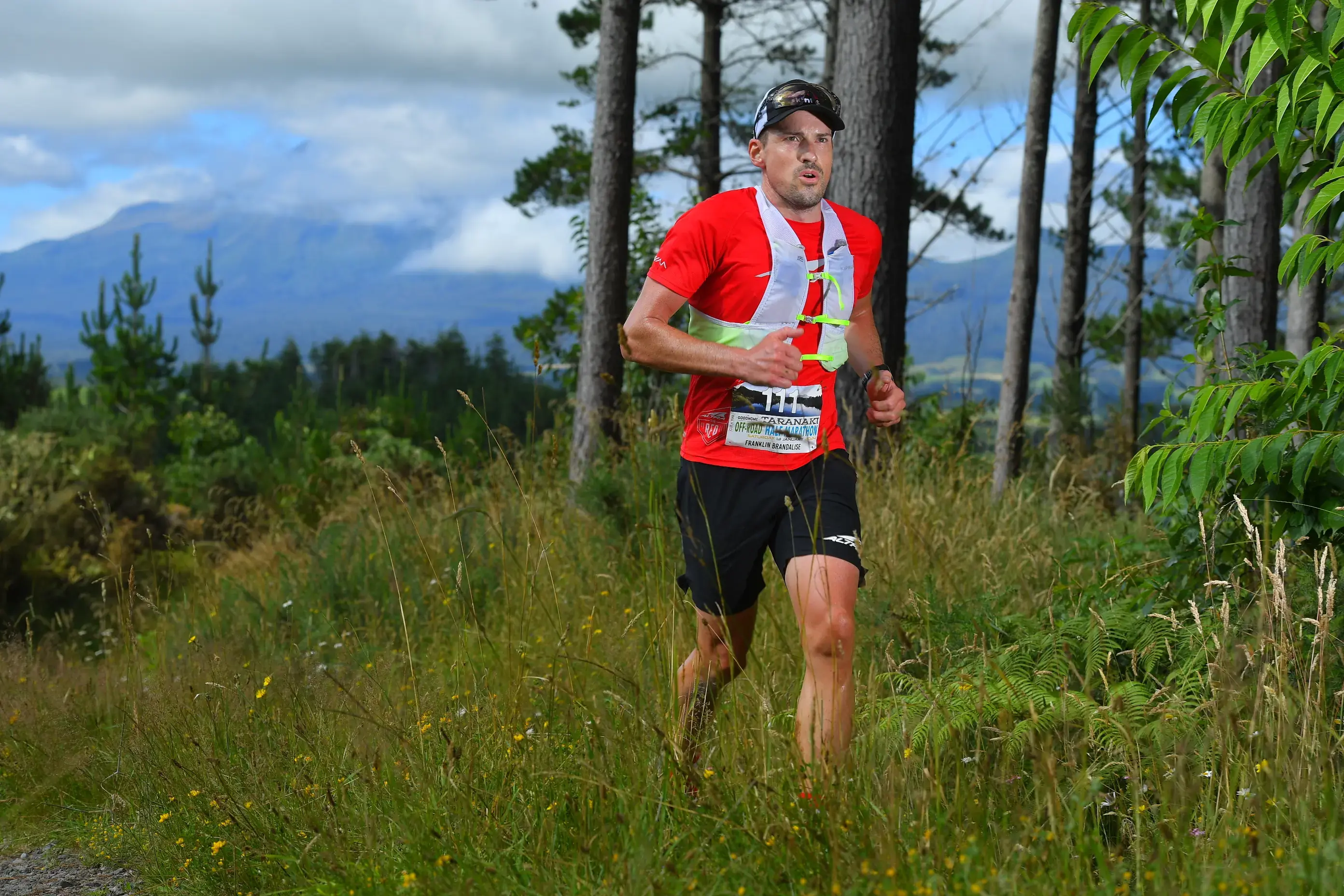 Guided trail running through New Zealand forest trails